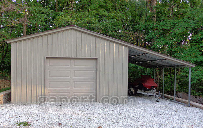 One car garage, side awning for parking showing a jet ski. This one is installed on gravel.
