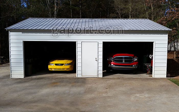 24x30x9 metal garage with two 10x7 roll-up steel garage doors in the 30 foot side wall.