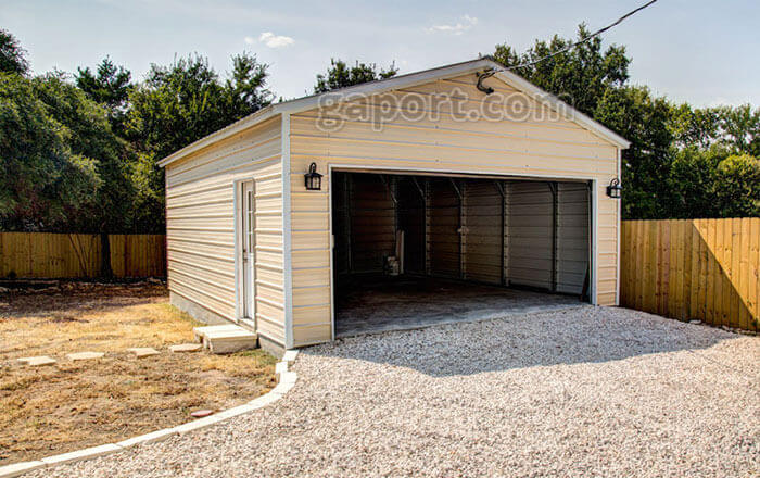 This metal garage has a 16 foot wide home garage door installed, suitable for two cars.