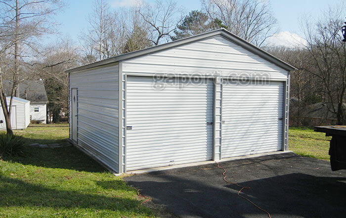 Alabama installation showing a 20x20 metal garage with 2 9x8 roll-up locking garage doors.