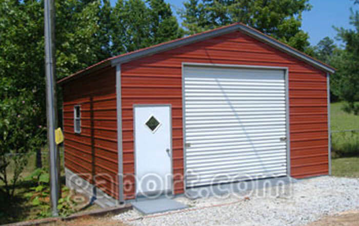 Red metal garage in a size 20x20x9 with a walk thru door one 10x9 roll up garage door.