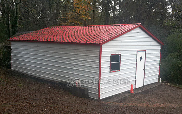 White metal garage with red roof and trim, one window and one walk-thru door