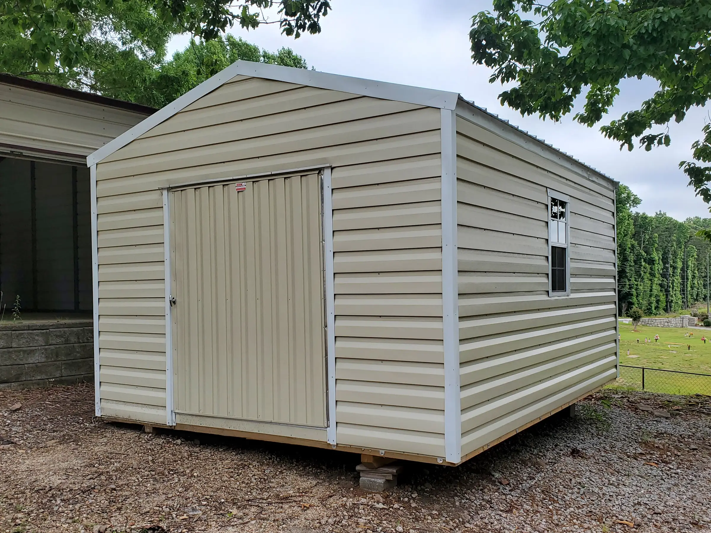 Portable structure in a 12 by 16 size with sixty inch wide door and two windows.