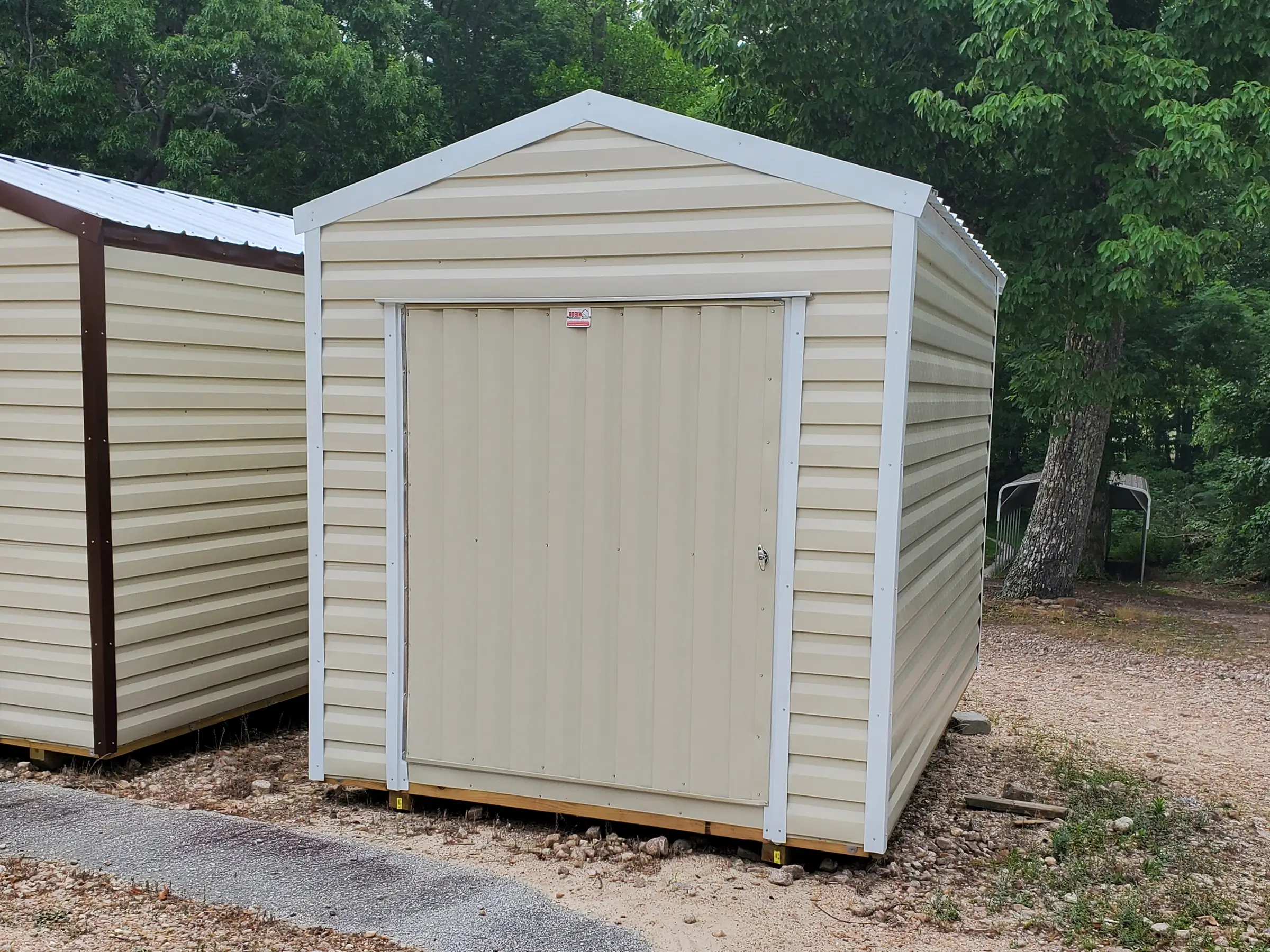 8 by 12 portable storage building equipped with an extra wide door for your motorcycle or riding lawn mower.