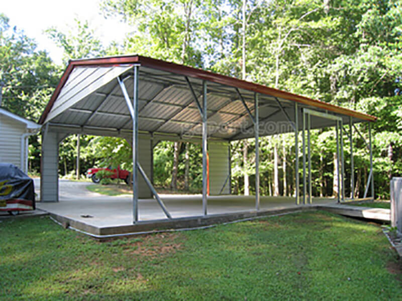 Interior view of side entry metal carport looking up the driveway through the two openings for a vehicle to enter.