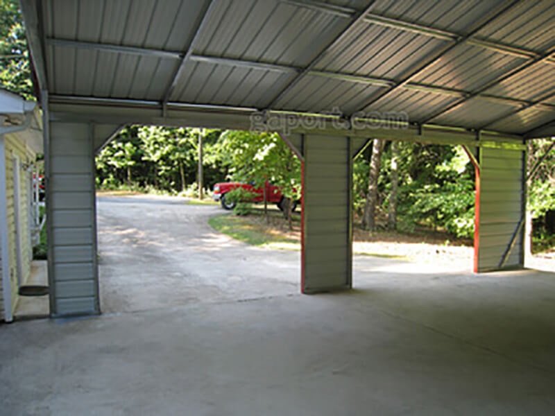 Interior view of side entry carport out into the yard from under the gable end.
