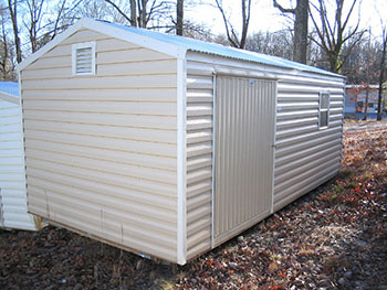 Pictured here, a larger portable building with an offset 5 food door.