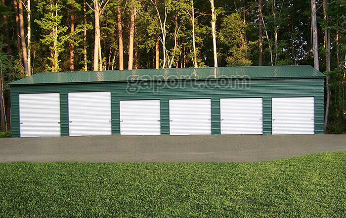 Nice 30x70x12x16.8 metal workshop sample with six roll up garage doors and a walk-thru door.