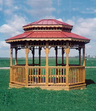 Pictured here is a gorgeous 10x12 oblong gazebo with red metal roof and benches.