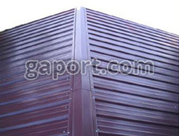 top view of a vertical roof on a metal building in burgundy with ridge cap