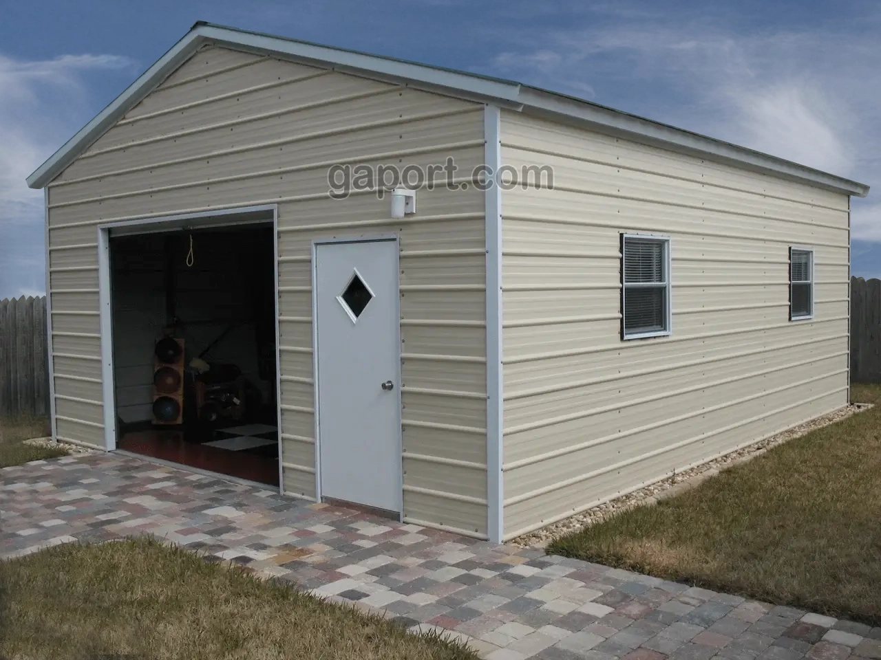 20x25x9 metal garage with roll up door and walk-in door plus windows.